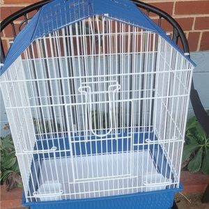 A small starter bird cage. Dont need it trying to get it out of my way.